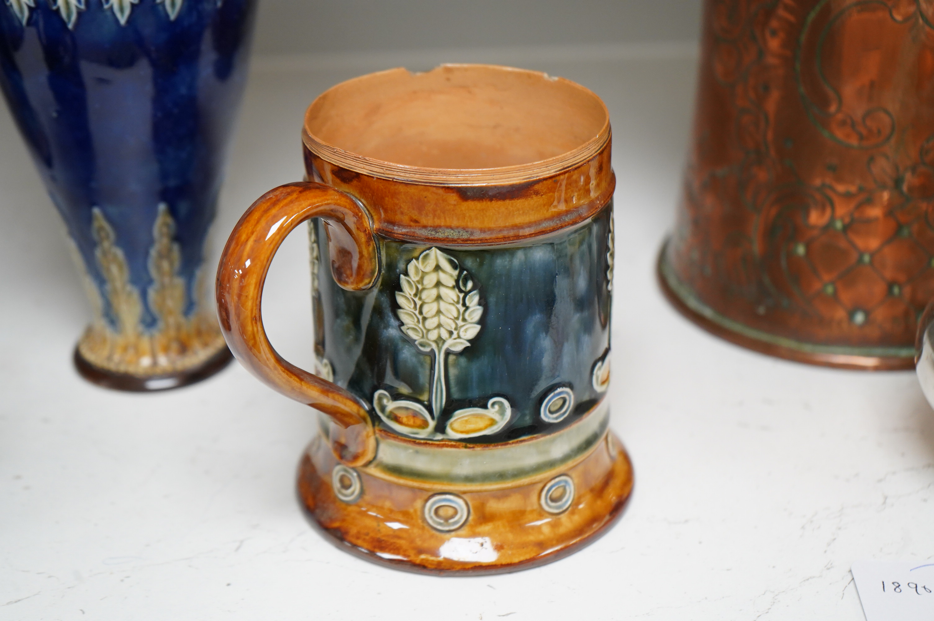 A Doulton Lambeth stoneware commemorative pitcher of William Ewart Gladstone 23cm high, together with a pair of vases two handled vase and a mug, (5).